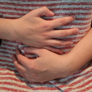 Person clutching his stomach