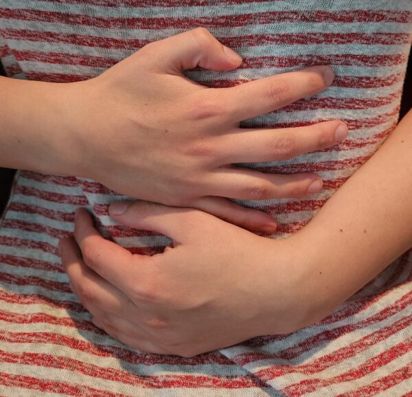 Person clutching his stomach